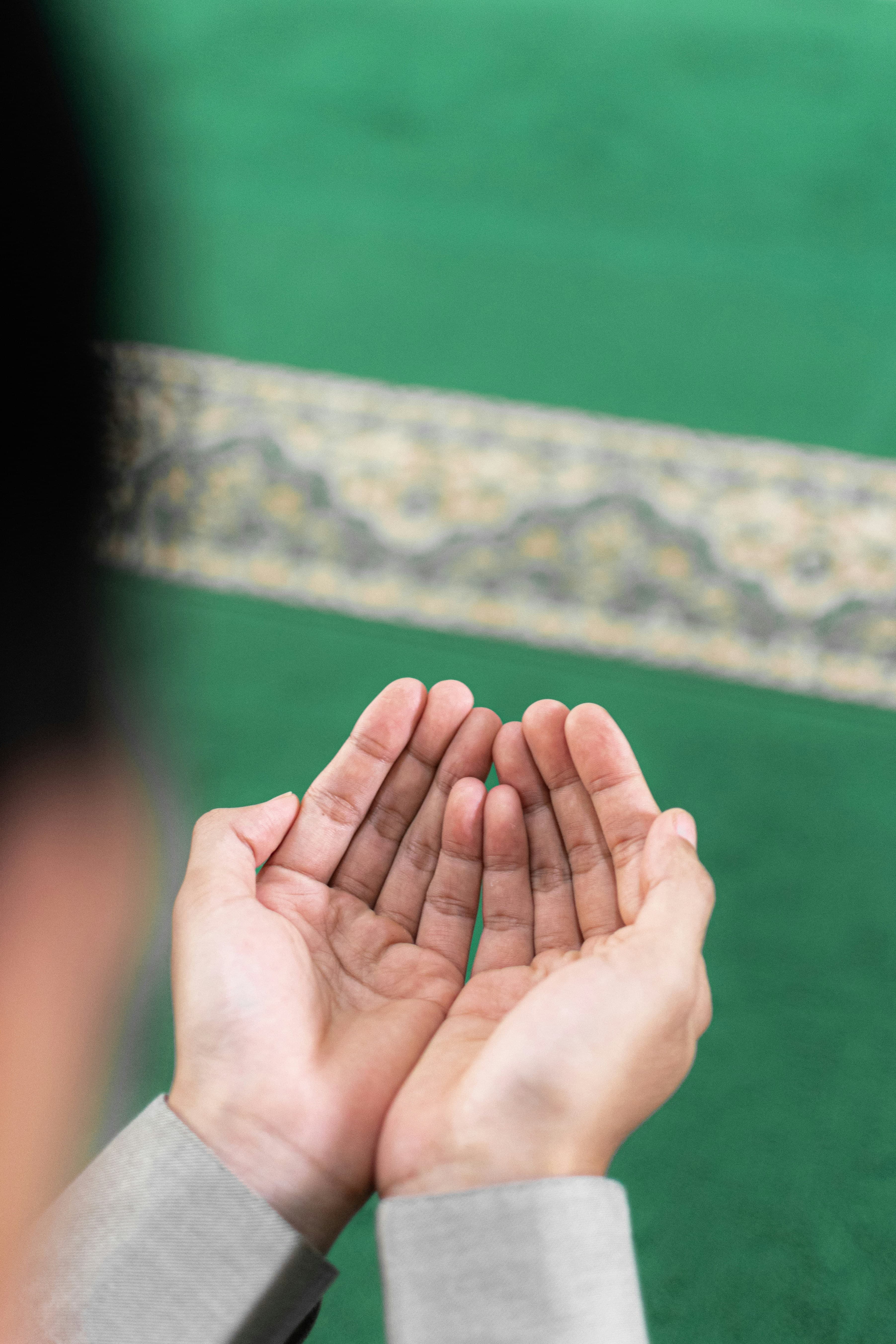 Two hands raised in dua