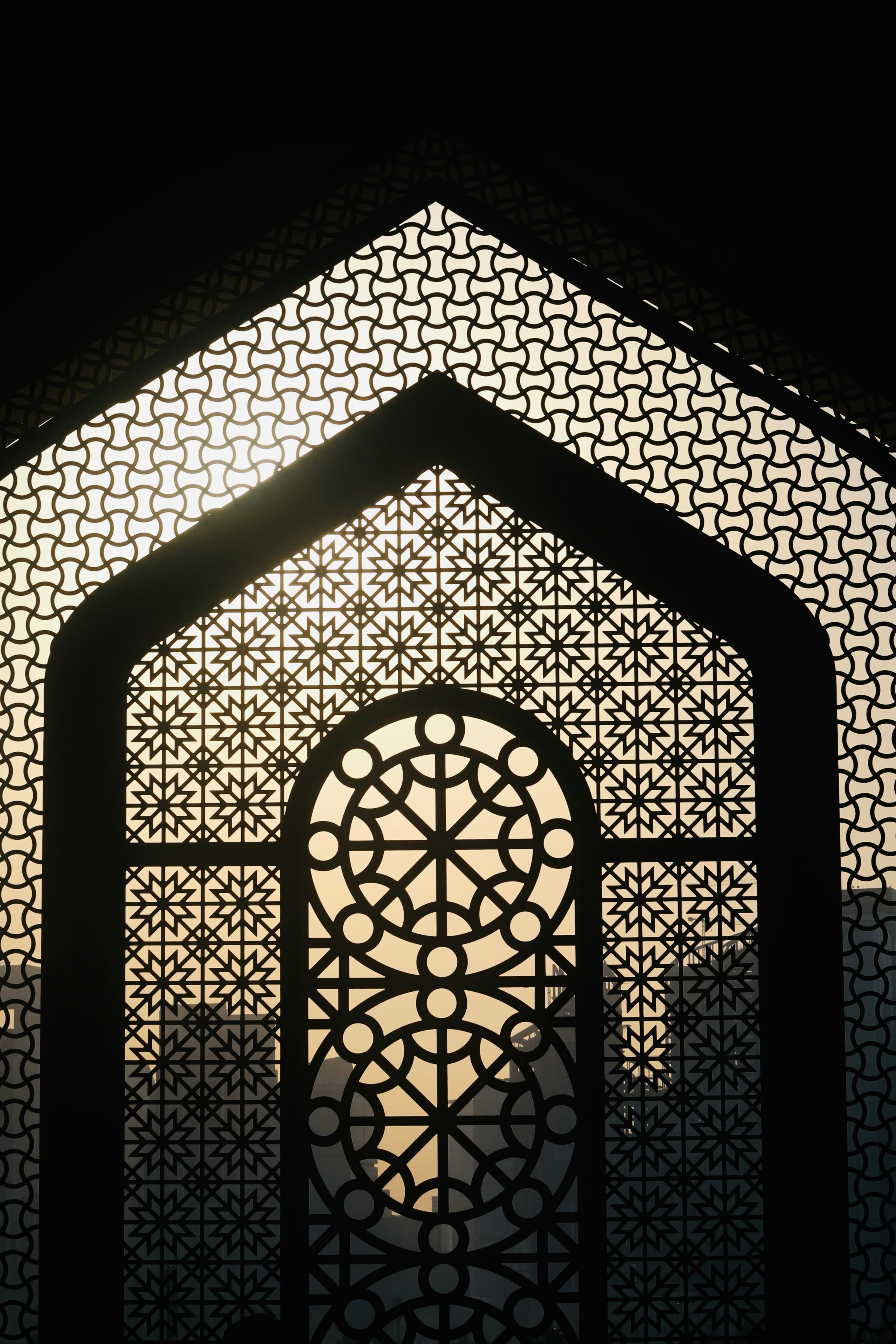 Light through a carved window screen